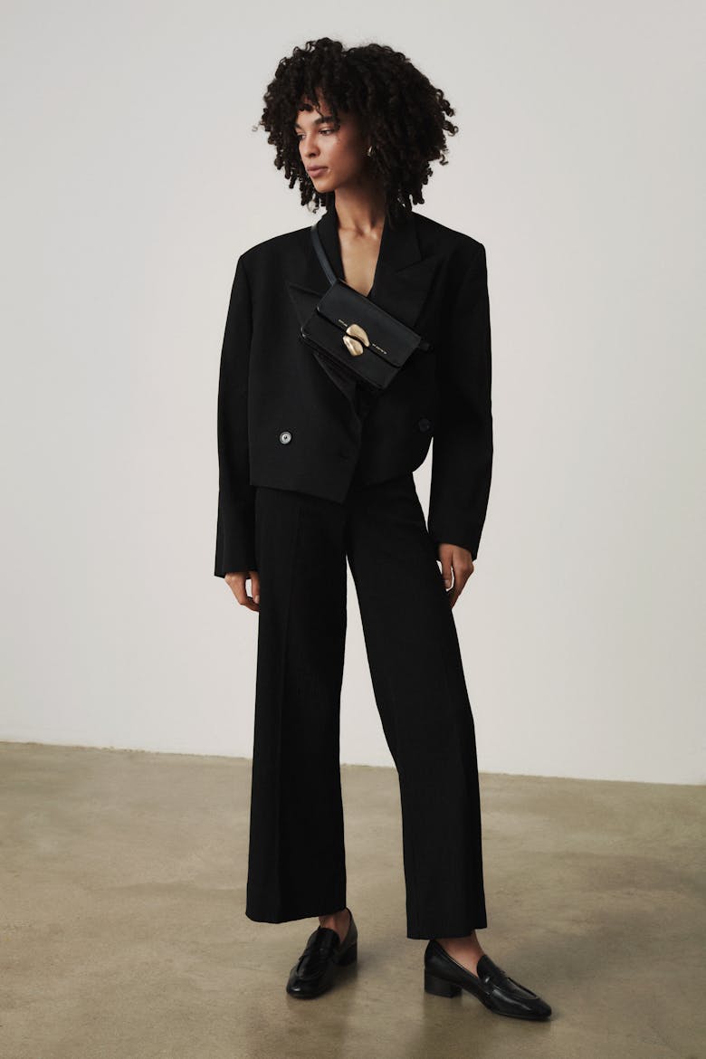 Mini Belt Bag with Sculptural Seal “glossy black”