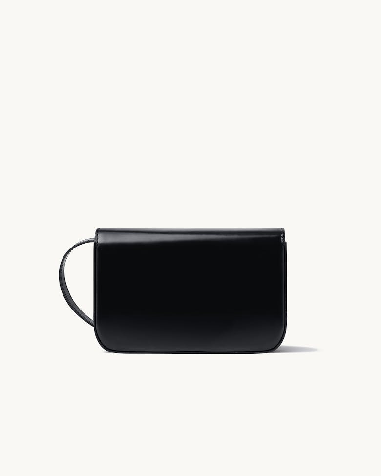 Flap Bag with Sculptural Seal “glossy black”