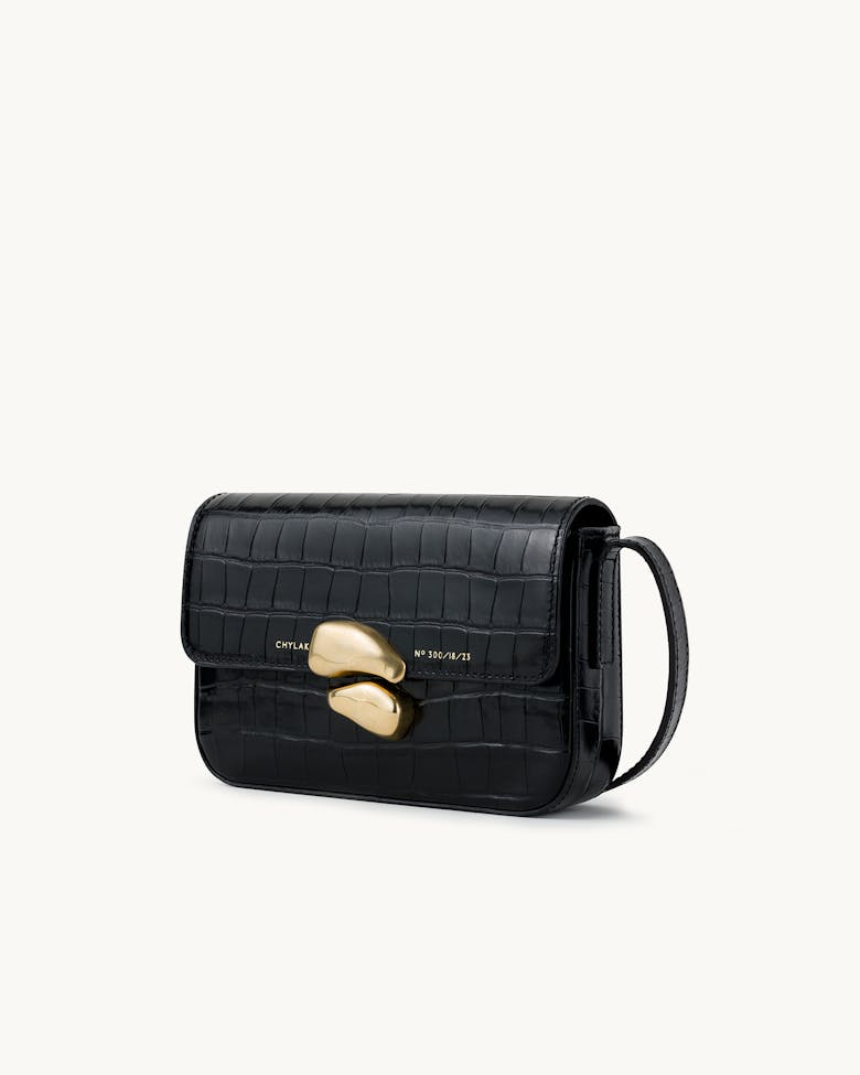 Flap Bag with Sculptural Seal “glossy black crocodile”