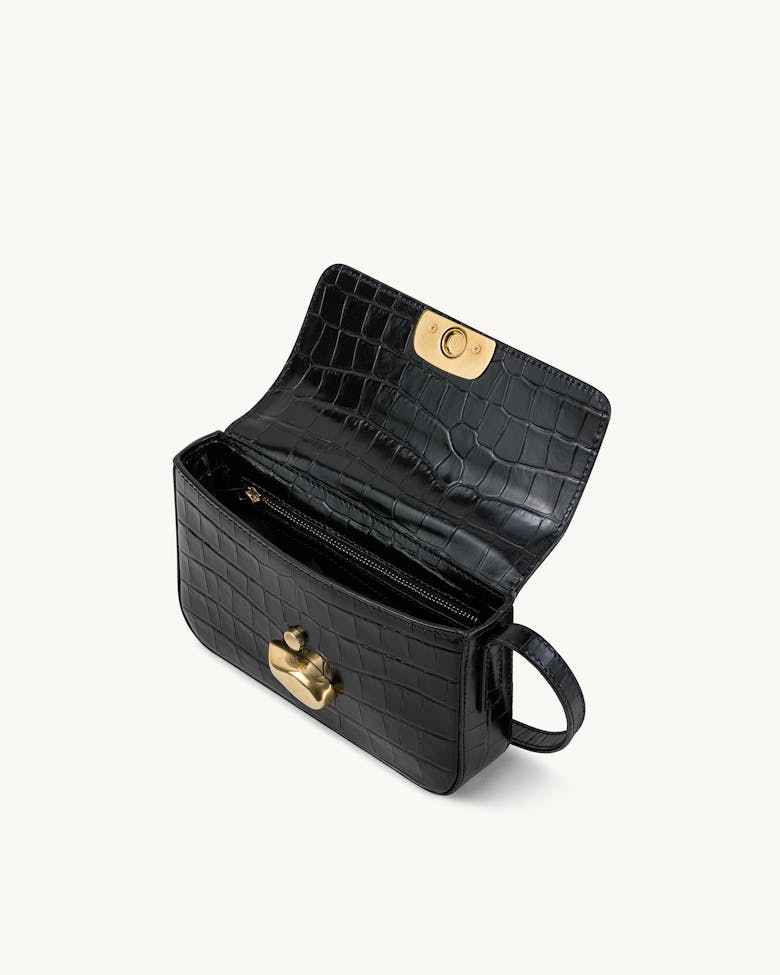 Flap Bag with Sculptural Seal “glossy black crocodile”