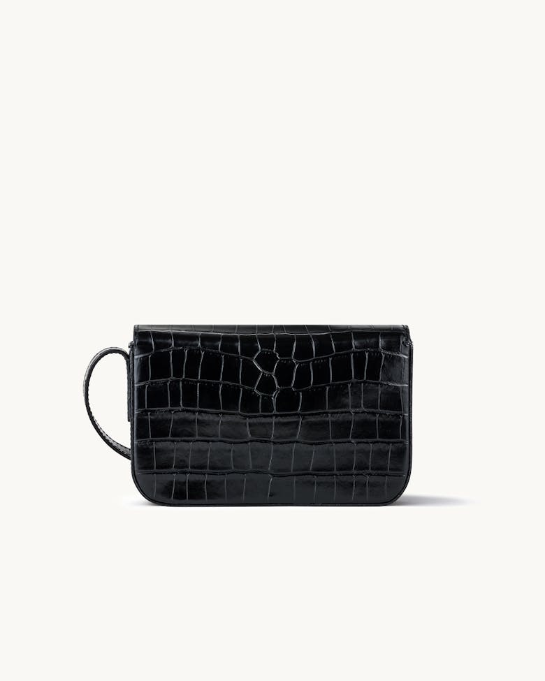 Flap Bag with Sculptural Seal “glossy black crocodile”