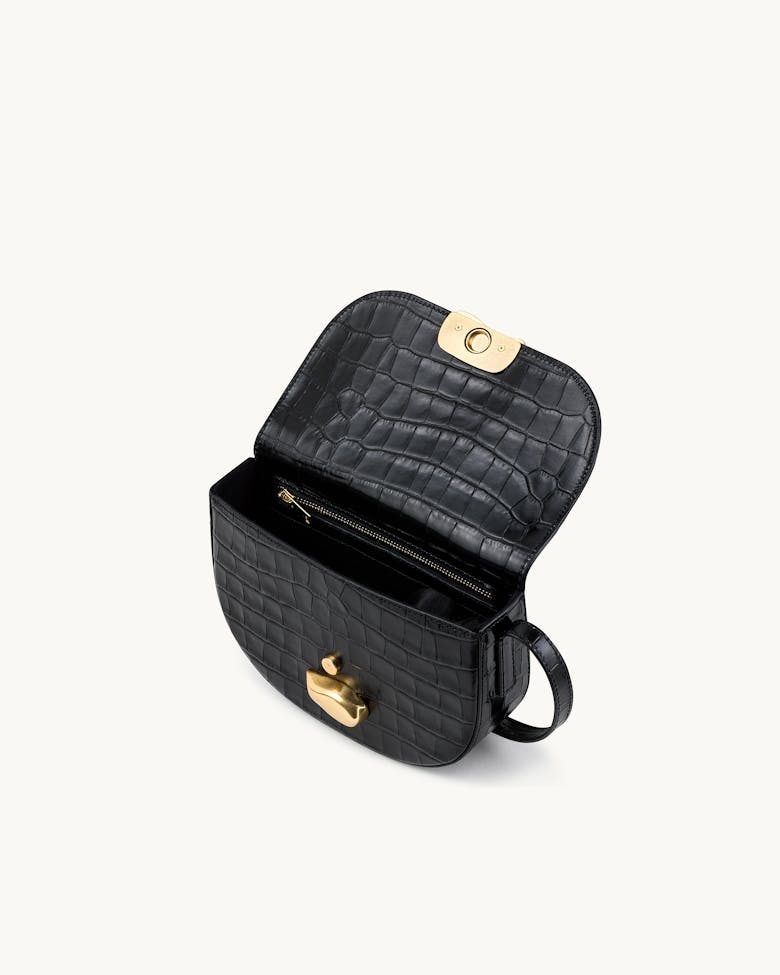 Saddle Bag with Sculptural Seal “glossy black crocodile”