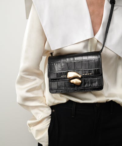 Mini Belt Bag with Sculptural Seal “glossy black crocodile”
