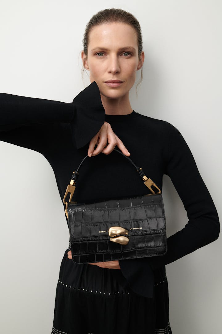 Shoulder Bag with Sculptural Seal “glossy black crocodile”