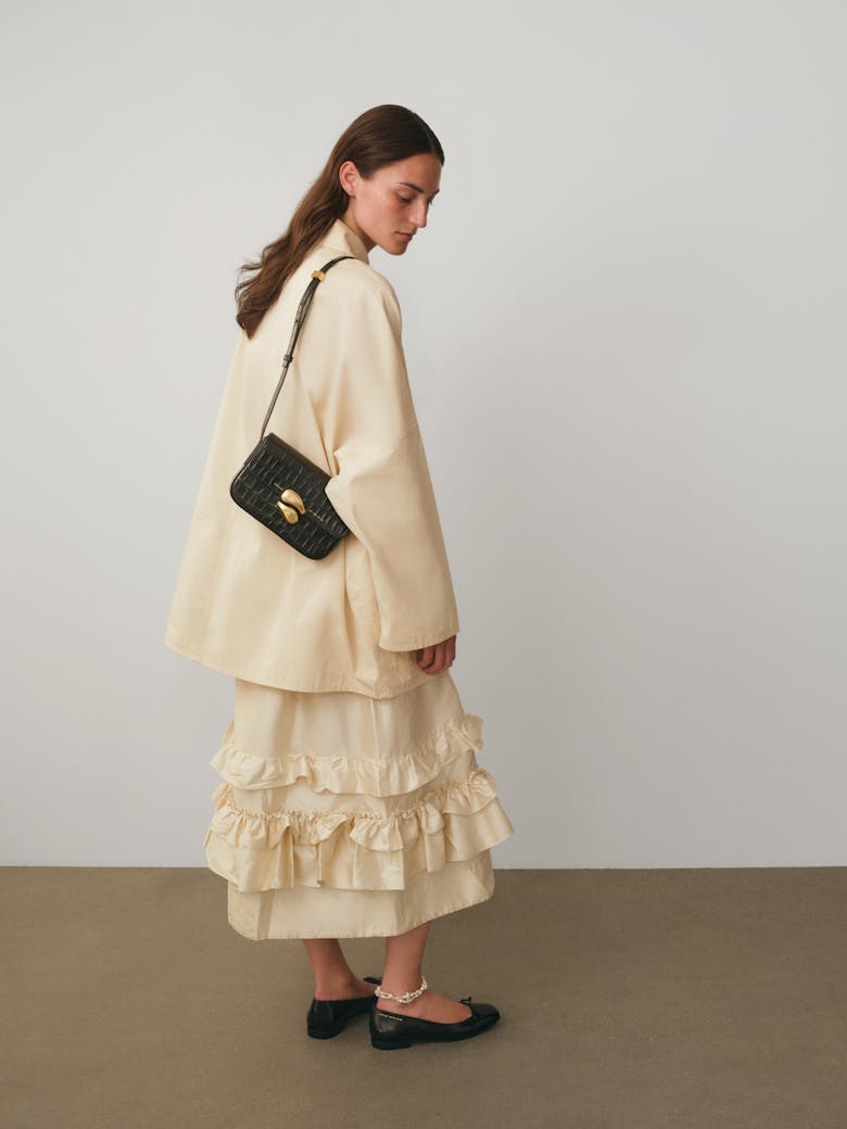 Flap Bag with Sculptural Seal “glossy black crocodile”