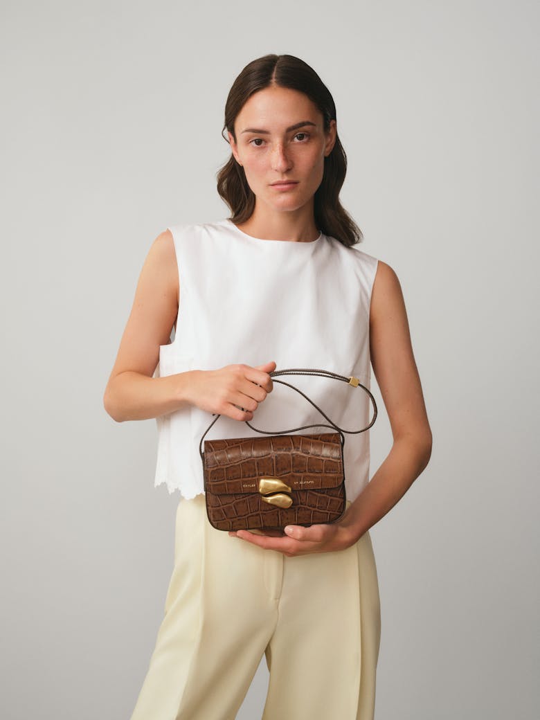 Flap Bag with Sculptural Seal “glossy hazelnut crocodile”