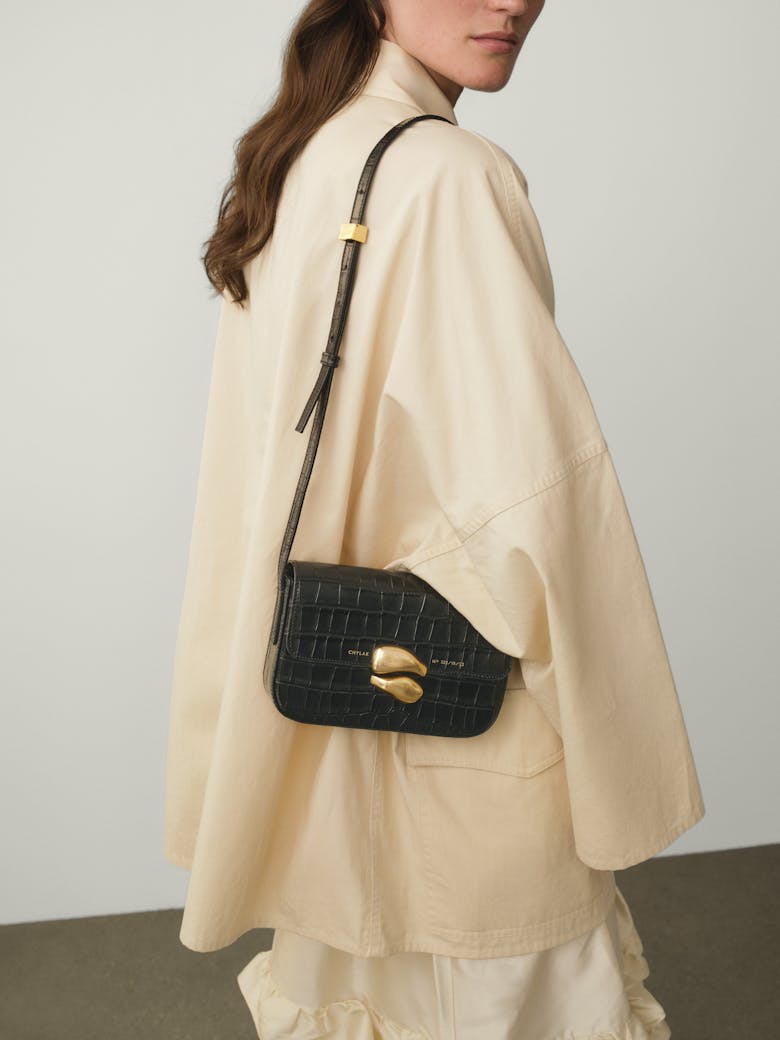 Flap Bag with Sculptural Seal “glossy black crocodile”