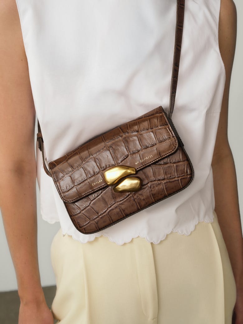 Flap Bag with Sculptural Seal “glossy hazelnut crocodile”